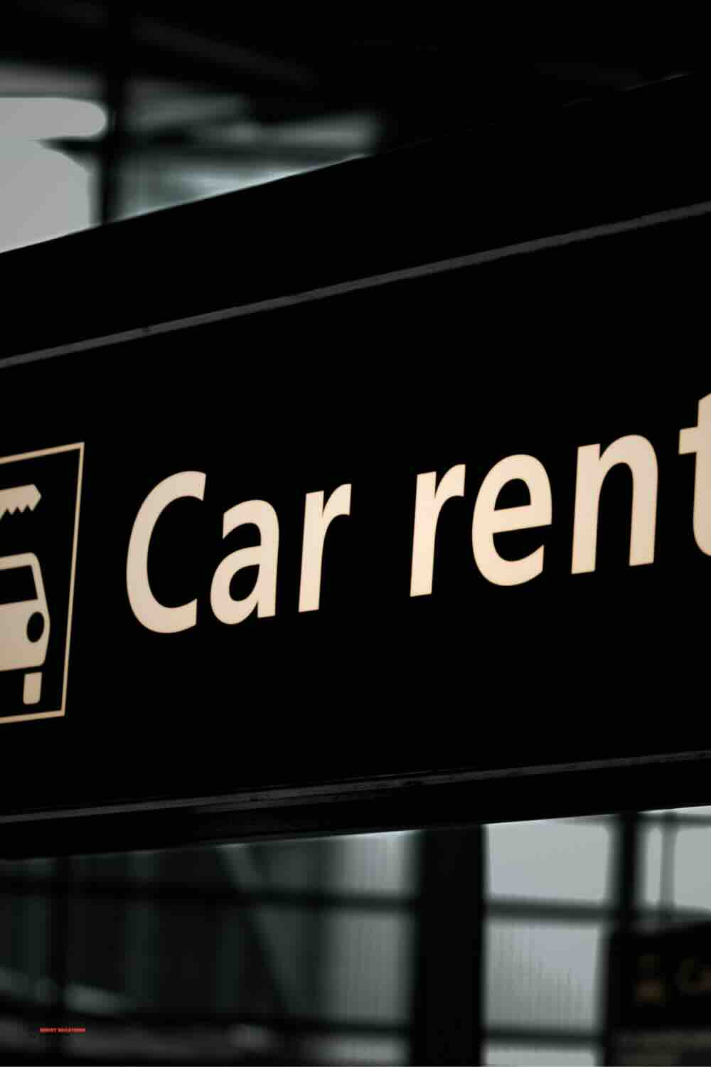 "Sign promoting CheapOAir car rental, highlighting affordable and convenient car rental options."