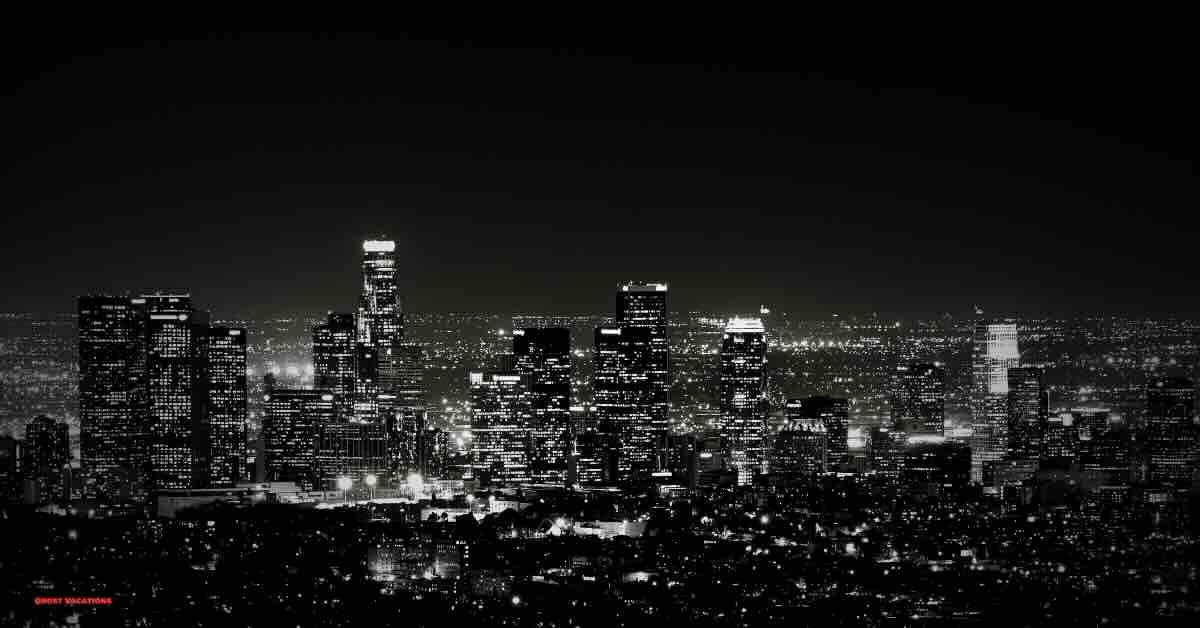 LA skyline at night, highlighting the city's famous haunted Los Angeles hotels amid the glowing city lights.