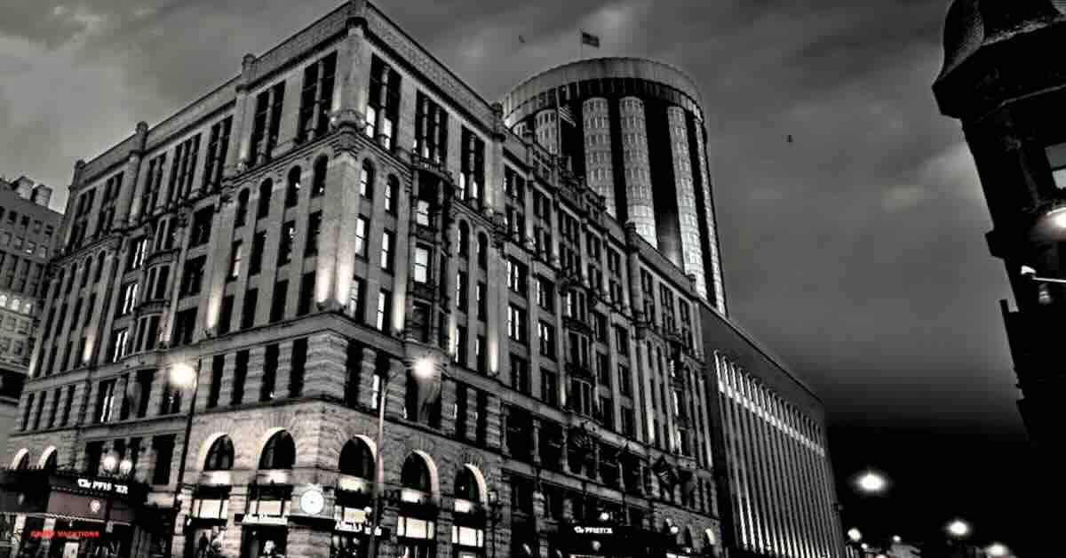 "Creepy exterior of the haunted Pfister Hotel, shrouded in eerie legends and ghostly tales."