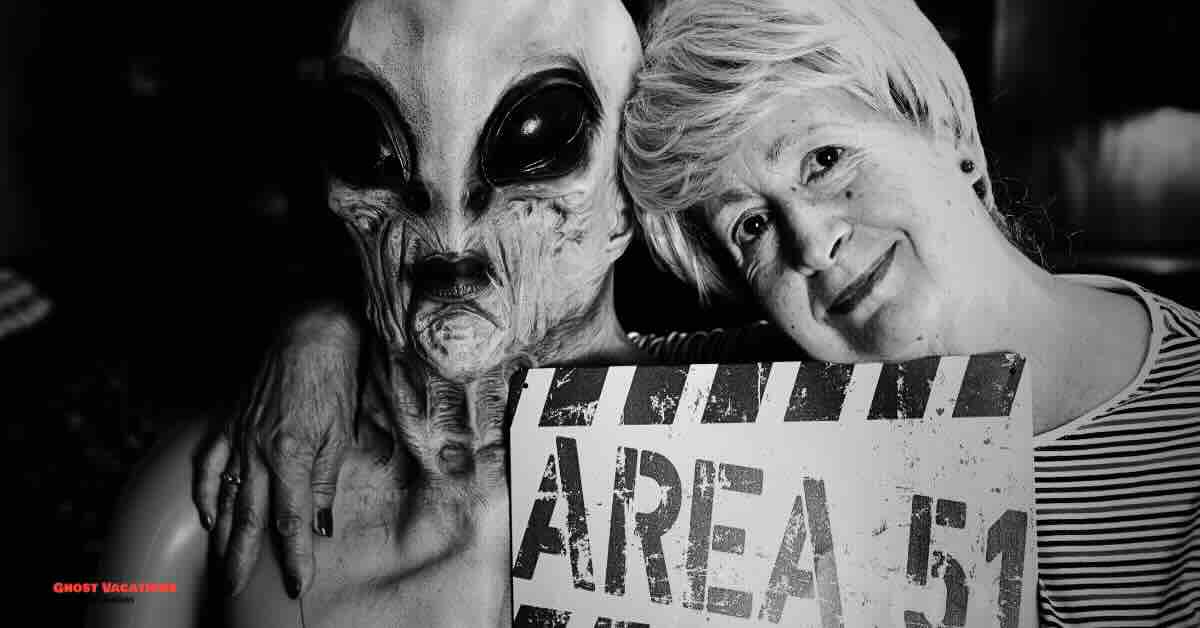 A woman poses with an alien figure during an full-day Area 51 tour, capturing the fun and mystery of the experience.