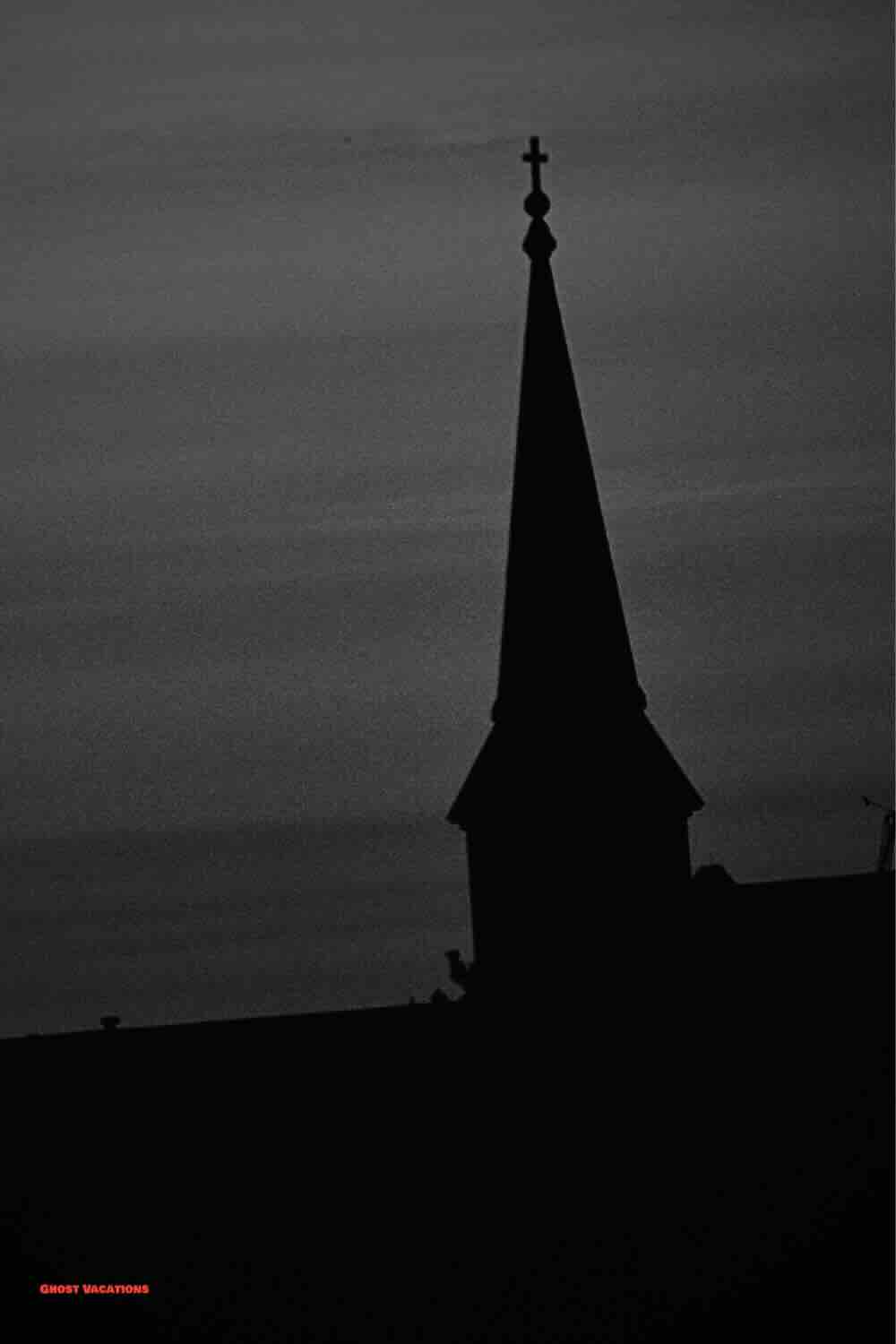 A twilight view of Salem's skyline, featuring historic architecture that holds the secrets of haunted hotels in Salem MA, bathed in an eerie glow.