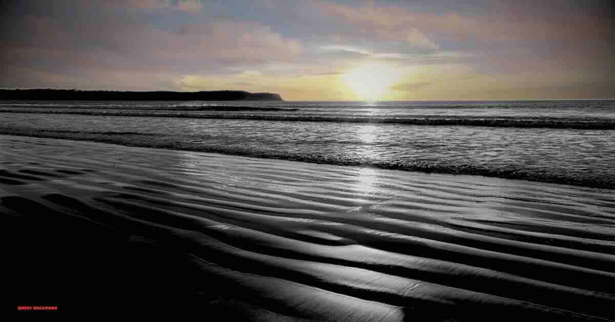 a backdrop of a sandy beach in San Diego, hinting at the haunted hotels in san diego